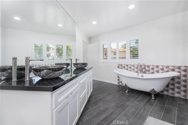 6 Bronco Ln, Bell Canyon, CA 91307 - full bath with recessed lighting, a sink, a freestanding tub, baseboards, and wood finished floors