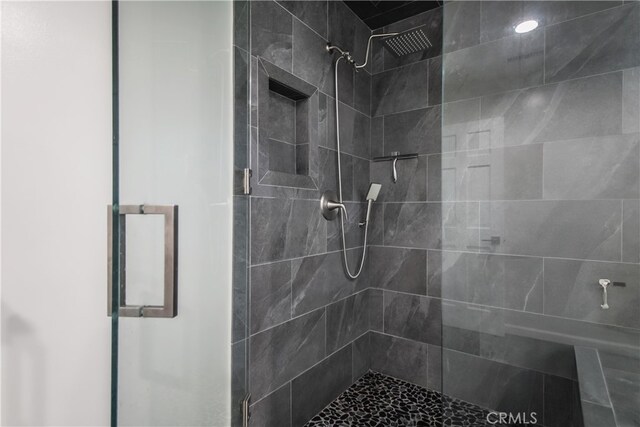 full bathroom featuring a shower stall