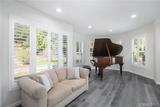 living area with recessed lighting, dark wood finished floors, and baseboards