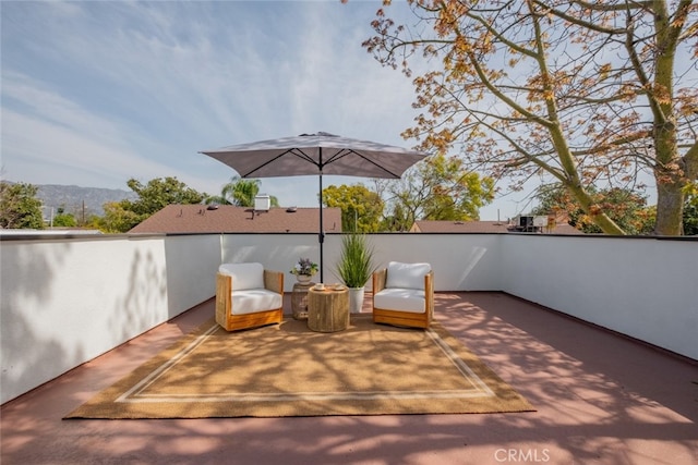 view of patio / terrace with a mountain view