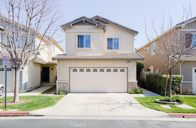 view of front of property featuring driveway, a garage, stone siding, a tiled roof, and stucco siding