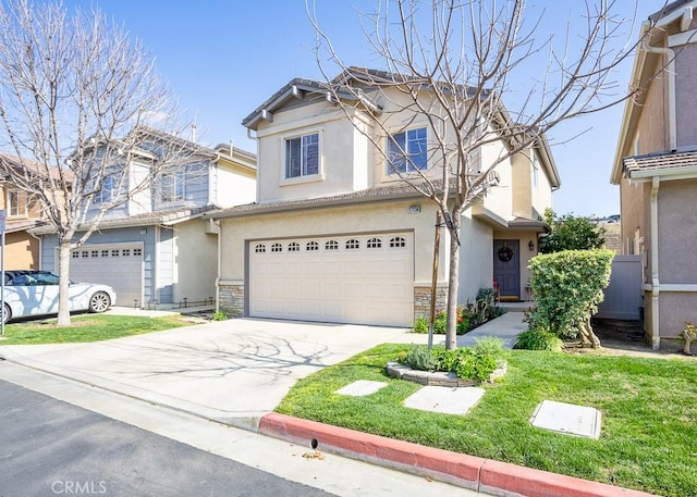 view of front of house featuring an attached garage, concrete driveway, stone siding, stucco siding, and a front lawn