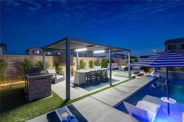 view of patio featuring an outdoor fire pit, outdoor dining area, a fenced backyard, exterior kitchen, and a fenced in pool