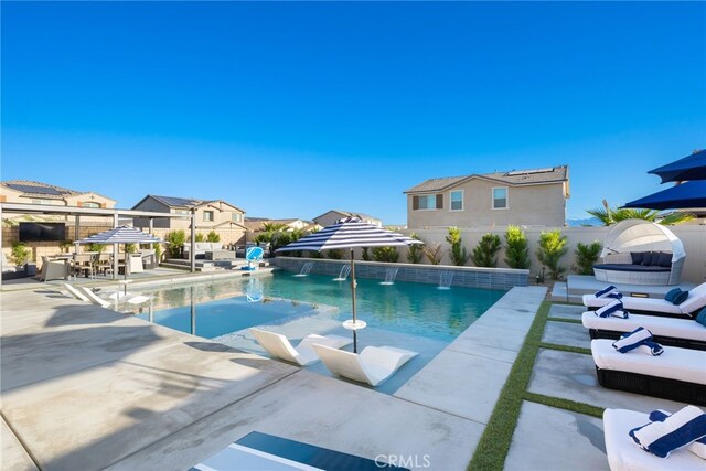 view of swimming pool with a patio, fence, and a fenced in pool