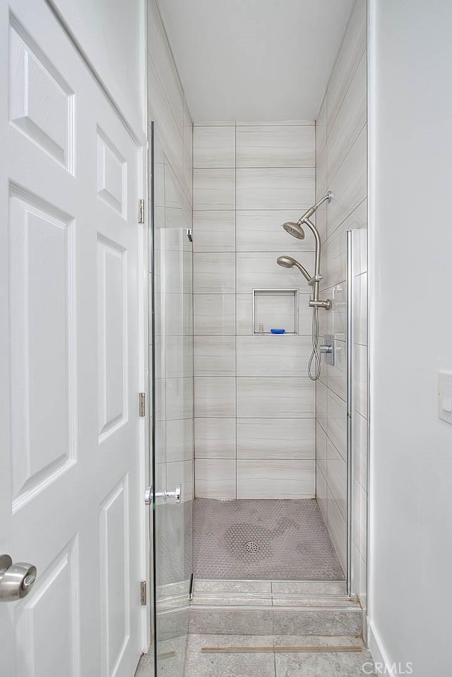 bathroom with a shower stall