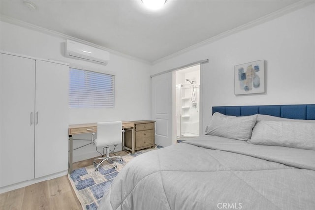 bedroom featuring ornamental molding, ensuite bath, a wall unit AC, and wood finished floors