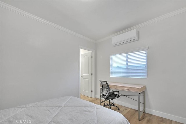 bedroom with light wood-style floors, baseboards, ornamental molding, and an AC wall unit