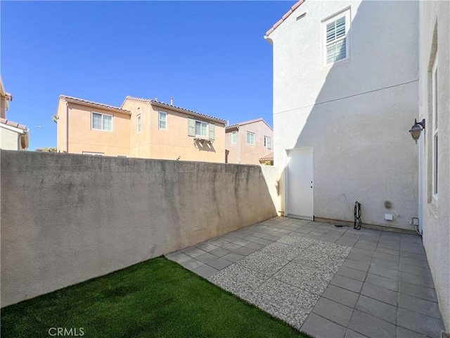 view of yard with a patio and fence