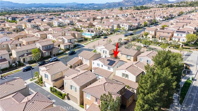 aerial view featuring a mountain view and a residential view