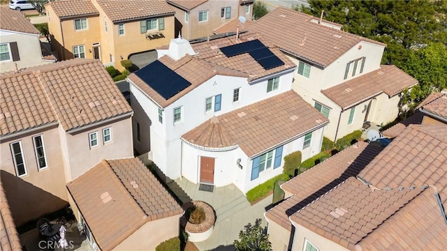 birds eye view of property with a residential view