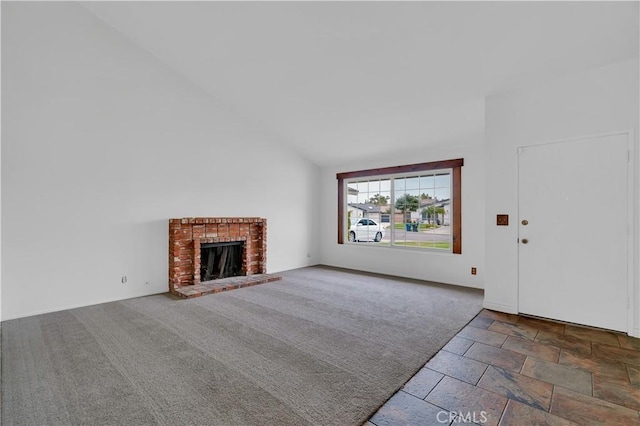 unfurnished living room featuring carpet floors, a fireplace, and high vaulted ceiling