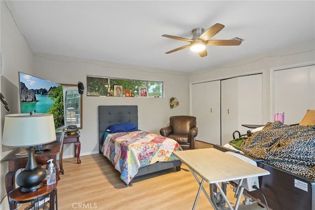 bedroom featuring a ceiling fan and light wood finished floors