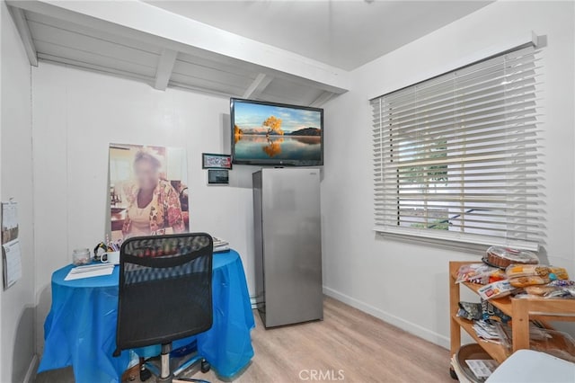 office featuring baseboards and wood finished floors