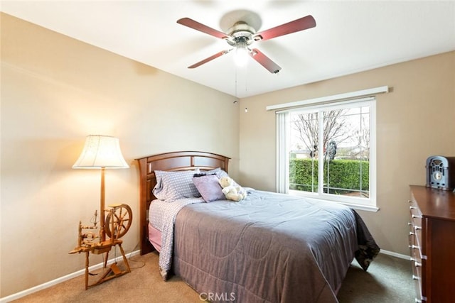 bedroom featuring ceiling fan, carpet, and baseboards