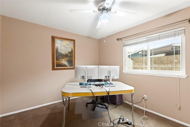 carpeted office featuring ceiling fan and baseboards