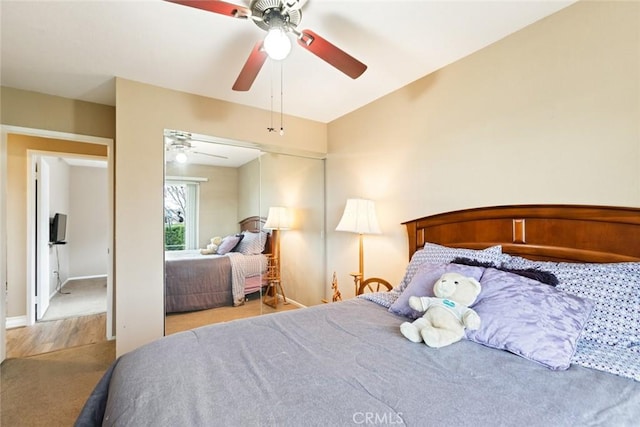 bedroom featuring a ceiling fan and baseboards