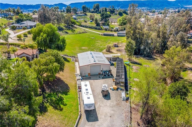 birds eye view of property featuring a mountain view