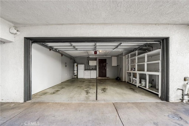 garage featuring strapped water heater and a garage door opener