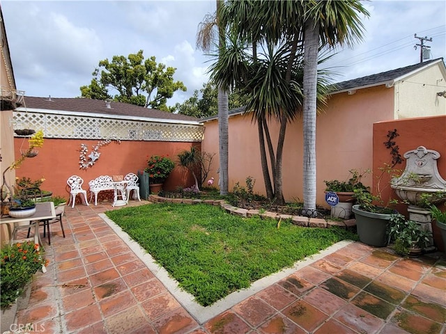 view of yard with a patio area and fence