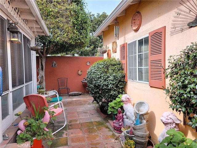 view of patio featuring fence