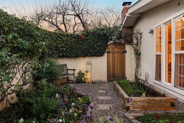 view of yard featuring a garden and fence