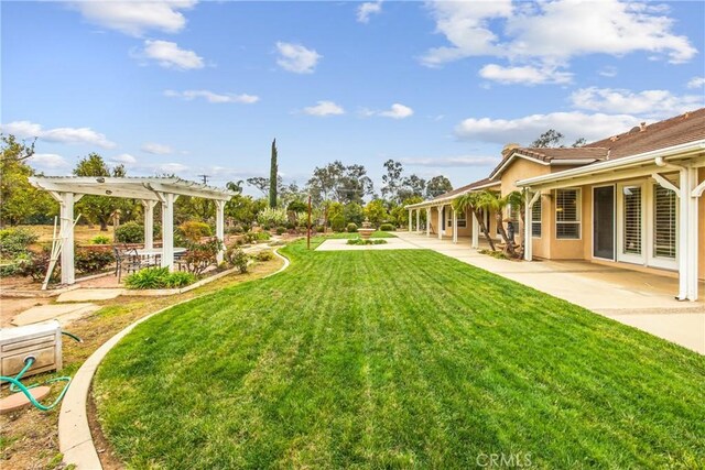 view of yard featuring a pergola and a patio