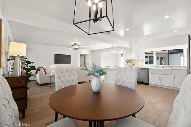 dining space featuring light wood-style floors and recessed lighting