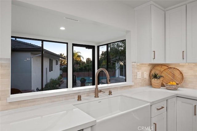 1985 Highland Oaks Dr, Arcadia, CA 91006 - kitchen with decorative backsplash, white cabinetry, and light countertops