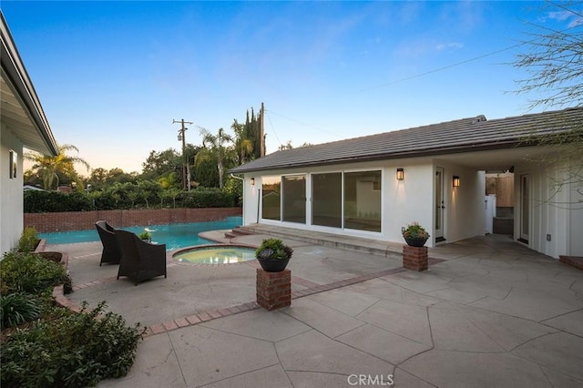 1985 Highland Oaks Dr, Arcadia, CA 91006 - patio terrace at dusk featuring a pool with connected hot tub and a patio area