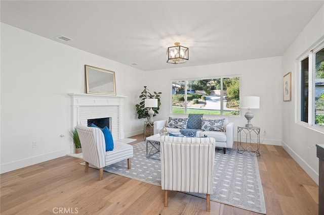 1985 Highland Oaks Dr, Arcadia, CA 91006 - living area with wood finished floors, a chandelier, and a fireplace