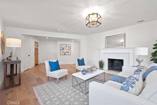 1985 Highland Oaks Dr, Arcadia, CA 91006 - living room featuring wood finished floors, a chandelier, a fireplace with flush hearth, and recessed lighting
