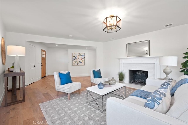 1985 Highland Oaks Dr, Arcadia, CA 91006 - living room featuring wood finished floors, a fireplace with flush hearth, and a chandelier