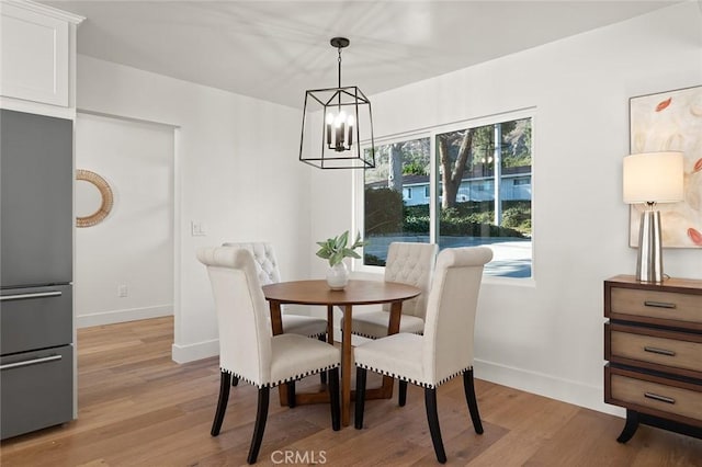 1985 Highland Oaks Dr, Arcadia, CA 91006 - dining room with a chandelier and light wood-style flooring