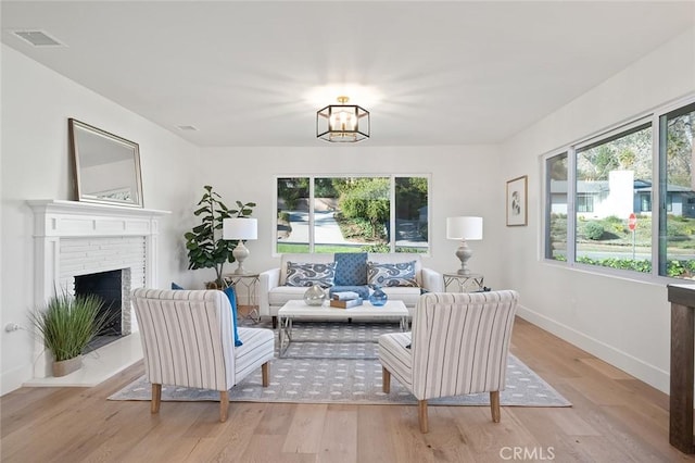 1985 Highland Oaks Dr, Arcadia, CA 91006 - living room with light wood-style flooring, a chandelier, and a fireplace