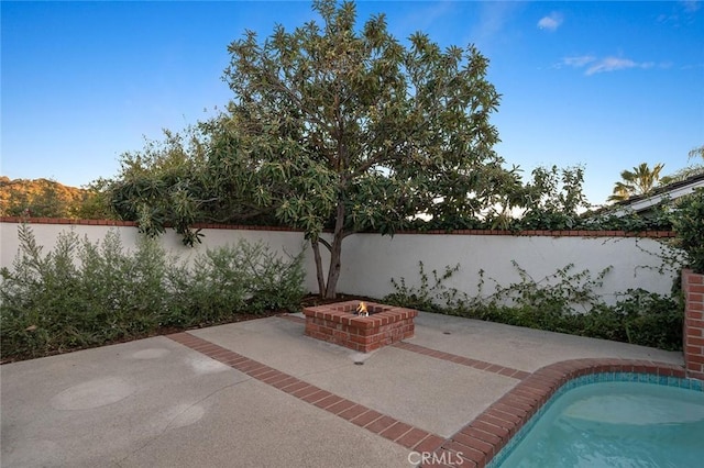 view of patio / terrace with a fire pit