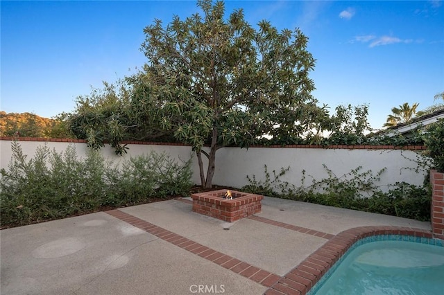 1985 Highland Oaks Dr, Arcadia, CA 91006 - view of patio with an outdoor fire pit