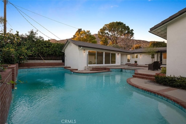 swimming pool featuring a patio area