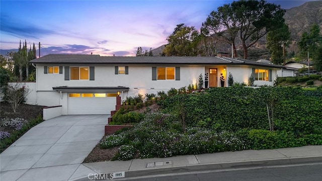 1985 Highland Oaks Dr, Arcadia, CA 91006 - view of front of home featuring stucco siding, driveway, and a garage