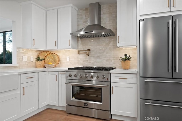 1985 Highland Oaks Dr, Arcadia, CA 91006 - kitchen with high end appliances, wall chimney range hood, light countertops, and white cabinetry