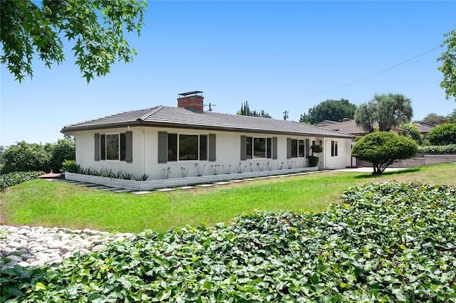 1985 Highland Oaks Dr, Arcadia, CA 91006 - rear view of property with stucco siding, a chimney, and a lawn