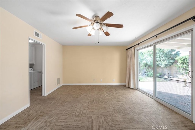 empty room featuring carpet floors, baseboards, and visible vents