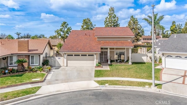 view of front of property featuring a tile roof, concrete driveway, a gate, fence, and a front lawn