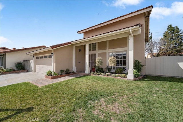 mediterranean / spanish home with a garage, concrete driveway, fence, a front yard, and stucco siding