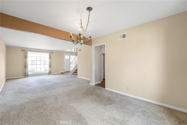 carpeted spare room featuring a chandelier, stairway, visible vents, and baseboards