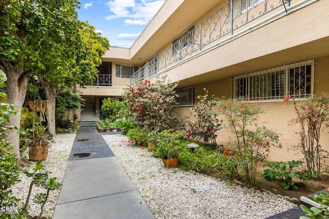 view of home's community featuring stairs