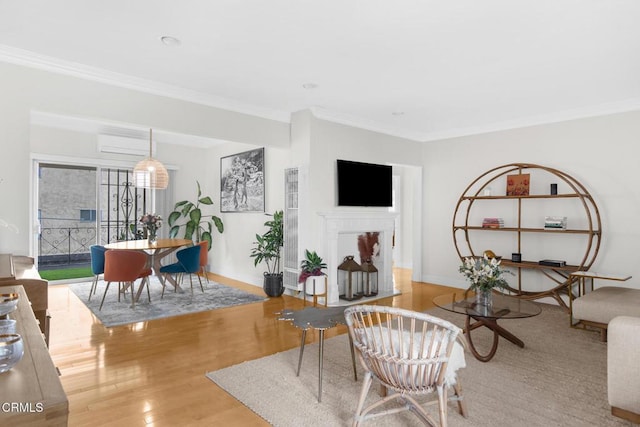 living room with ornamental molding and wood finished floors