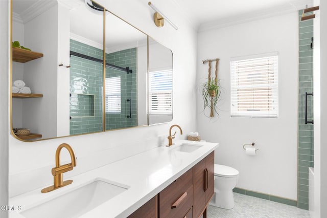 full bathroom featuring tiled shower, a sink, and crown molding