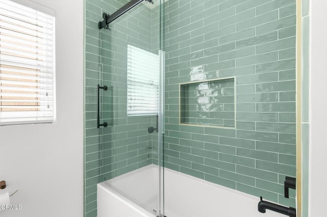 full bathroom with shower / bath combination with glass door and a healthy amount of sunlight