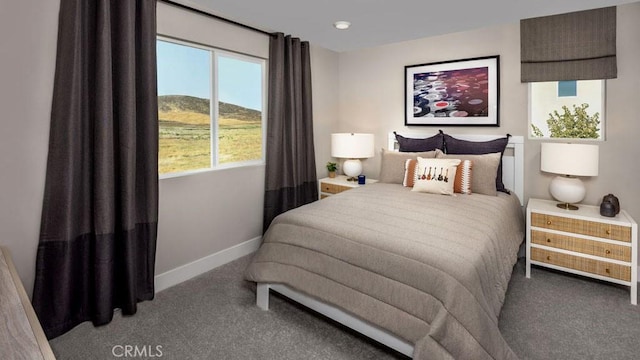 bedroom featuring carpet flooring and baseboards