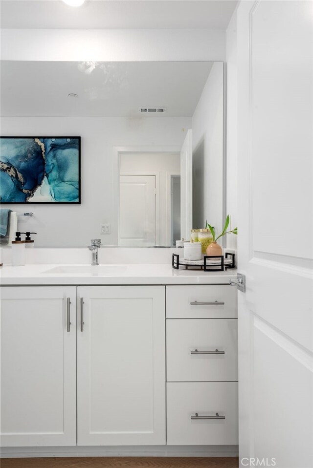 bathroom featuring visible vents and vanity